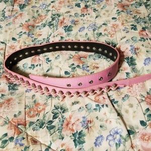 A pink studded and bullet belt